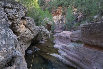 Obraz premium river flowing through the red stone canyon. fuentes de ayodar, Spain
