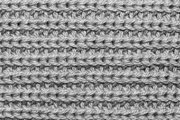 Close up shot of knitting on woolen fabric for background use
