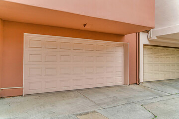 Exetrior of houses in Long Beach CA with white doors on the attached garages