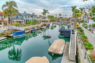 Fototapeta na wymiar Boat docks and stairs at a calm canal in Long beach California neighborhood