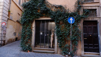 Fototapeta na wymiar Old street in Trastevere in Rome, Italy. Trastevere is rione of Rome, on the west bank of the Tiber in Rome