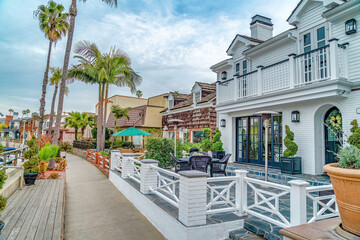 Pathway along homes with patios overlooking the canal in Long Beach California