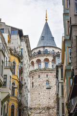 Famous historical and tourist place Galata tower in Istanbul, Turkey with blue sky background