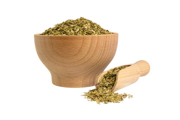 Fototapeta na wymiar Dried leaves of yerba mate tea in wooden bowl and scoop isolated on white background. Nutrition. Traditional tea in South-America.