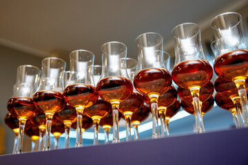 A lot of glasses with cognac