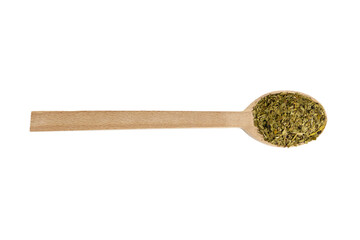 Dried leaves of yerba mate tea on wooden spoon isolated on white background. nutrition. Traditional tea in South-America.