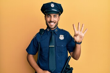 Obraz premium Handsome hispanic man wearing police uniform showing and pointing up with fingers number four while smiling confident and happy.