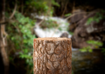 Stone empty podium product for cosmetic display with defocused nature background