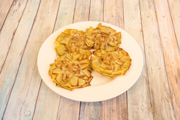 White plate with artichoke flowers