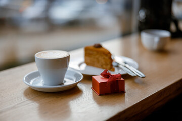 gift coffee and cake on a cozy cafe terace