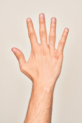 Hand of caucasian young man showing fingers over isolated white background counting number 5...