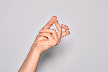 Hand of caucasian young man showing fingers over isolated white background snapping fingers for...