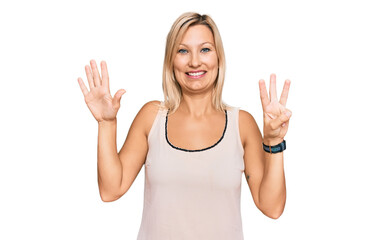 Middle age caucasian woman wearing casual clothes showing and pointing up with fingers number eight while smiling confident and happy.