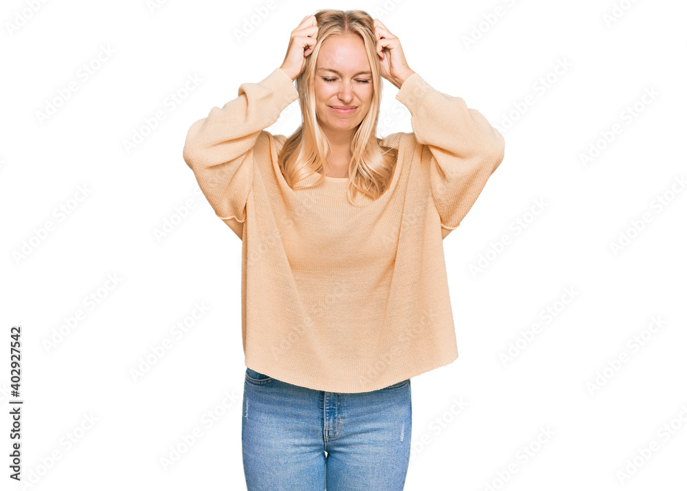 Sticker Young blonde girl wearing casual clothes suffering from headache desperate and stressed because pain and migraine. hands on head.