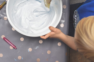 Kids activity of making slime as a science experiment for children to do indoors