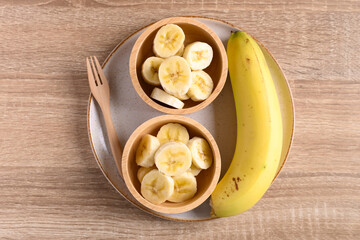 Sliced ripe banana fruit in a bowl ready to eating, Tropical fruit, Top view