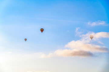 Balloons against blue sky and clouds on a sunny day in San Diego California