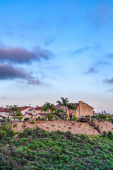 Houses with blue sky and clouds background in San Diego California neighborhood