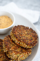 Veggie fritters with sauce on a plate