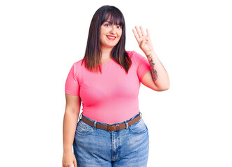 Young plus size woman wearing casual clothes showing and pointing up with fingers number four while smiling confident and happy.