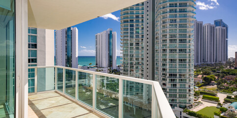 Apartment condominium flat balcony with view of coastal buildings nice scene - obrazy, fototapety, plakaty