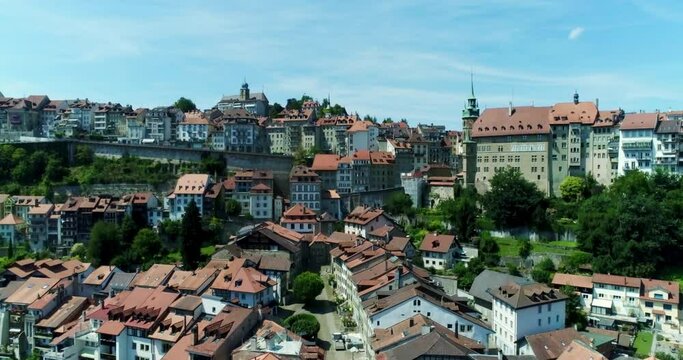 Drone aerial rising over fribourg switzerland village - city summer 1