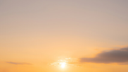 The morning sky looked like a bright golden sky. The sunrise is decorated with clouds in various shapes. Looks beautiful.