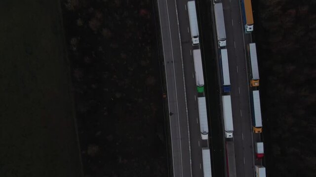 Aerial view of a big queue of Lorries that wait in line for border crossing control from the United Kingdom to France on the M20 before Dover on Christmas Morning 2020