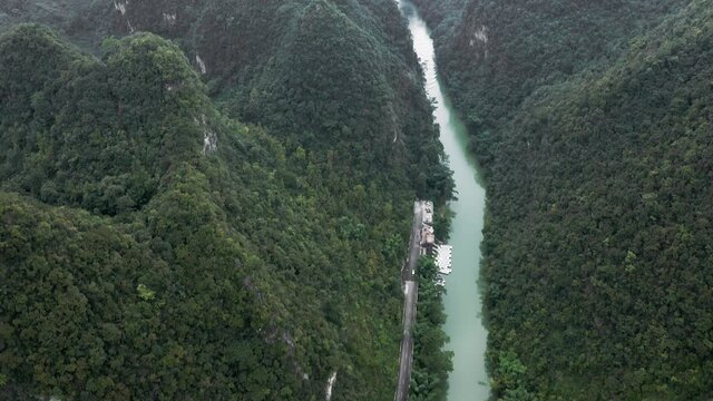 Amazing karst mountain river landscape, misty scenery, aerial tilt reveal
