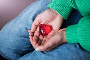 Girl hands giving red heart. Love photo. Sensual. Romantic. Lifestyle. Photo. Valentines day. 
