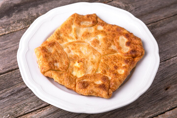 Pie with cottage cheese, potatoes, cheese or meat. Balkan cuisine. National cuisine. Nourishing, useful, natural. Rustic cuisine.
