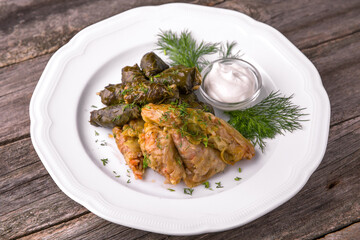 Dolma. Cabbage rolls. Rolls of rice with meat and vegetables wrapped in grape and cabbage leaves. Balkan cuisine. National cuisine. Nourishing, useful, natural. Rustic cuisine.