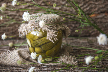 Preserved autumn vegetables. Delicious preserved crunchy pickles, in the glass jar. Rustic style