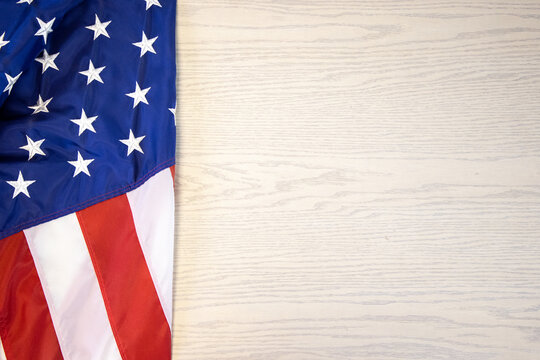 American flag isolated on a white washed wooden background, negative space 