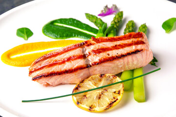 Baked salmon garnished with asparagus. Italian restaurant. Menu. Free space for text