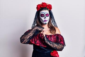 Young woman wearing day of the dead costume over white doing time out gesture with hands, frustrated and serious face