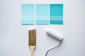 Paint colour swatches with paintbrush, paint roller on white background