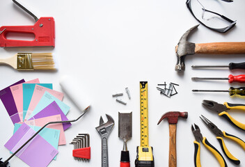 Home improvement and carpentry tools display on white background with space for copy