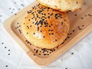 Fresh homemade burger buns with sesame seed.