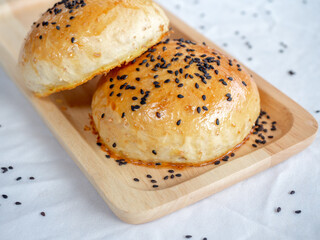 Fresh homemade burger buns with sesame seed.