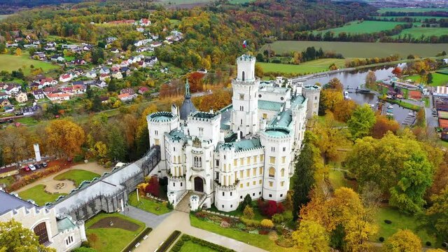 Drone view of medieval castle in Hluboka nad Vltavou, Czech Republic. Castle Hluboka nad Vltavou is one of the most beautiful castles in Czech Republic. Hluboka nad Vltavou in autumn with red foliage