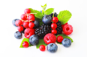 Fresh berries mix isolated on white background, top view. Strawberry, Raspberry, Red currant, Blueberry and Mint leaf, top view
