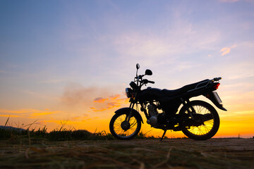 Motorcycle in sunset and sunrise with copy space.Silhouette motorbike