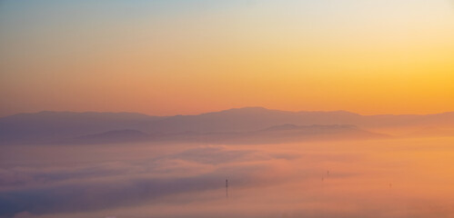 Surreal landscape of morning foggy..Morning clouds at sunrise.Landscape of fog and mountains of northern Thailand.