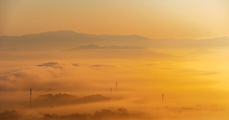 Surreal landscape of morning foggy..Morning clouds at sunrise.Landscape of fog and mountains of northern Thailand.