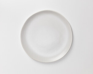 Blank white ceramic round dish isolated on white background with shadow, Flat lay of traditional handcrafted kitchenware concept