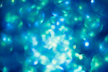 Shimmering blur spot light on blue aqua color background, Christmas concept