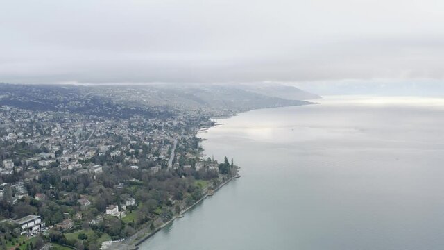 Drone Aerial of the beautiful swiss city center of lausanne located on the lake geneva (lac léman) in Switzerland during winter, Europe.