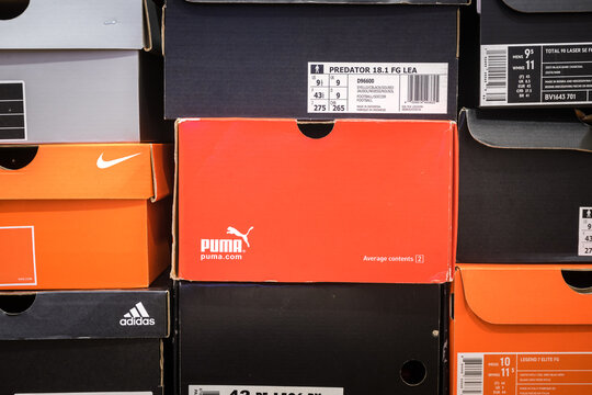 Bangkok / Thailand - April 2019 : Football shoe container boxes of varies brand are stack up in orderly, like keeping in collector room or shopping store. Pattern background photo.