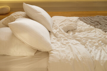 bed in the bedroom, white pillows and cozy linens